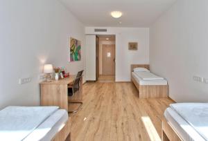 Postel nebo postele na pokoji v ubytování Hotel Dompes