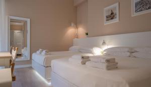 En eller flere senge i et værelse på Hotel Bristol