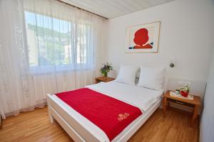 Ein Bett oder Betten in einem Zimmer der Unterkunft Hotel Artus
