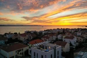 a view of a city at sunset at Adria Concept boutique apartments in Zadar