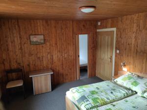 Postel nebo postele na pokoji v ubytování Apartmány Vranov