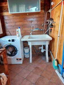 a bathroom with a sink and a washing machine at FuriaForte! in Ascoli Piceno