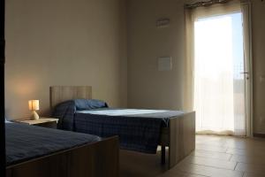 Postel nebo postele na pokoji v ubytování Terradimare