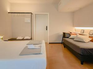 a bedroom with two beds and a sliding door at Villa Verlengia in Montesilvano