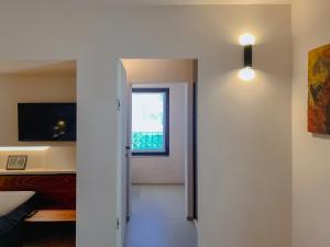 a room with a bed and a window and a door at Villa Verlengia in Montesilvano