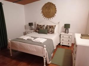 Ένα ή περισσότερα κρεβάτια σε δωμάτιο στο A casa da Carolina II