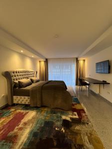 a bedroom with a bed and a table and a desk at Hotel Adrett am Dom - Digital Access in Cologne