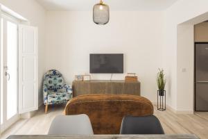 TV a/nebo společenská místnost v ubytování Suite Catedral Little Apartments