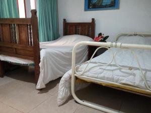 En eller flere senge i et værelse på Hermoso chalet en una muy buena ubicación