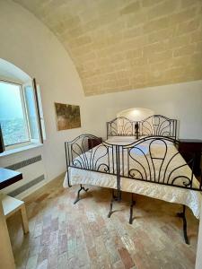 Postel nebo postele na pokoji v ubytování Dimora La Gravina