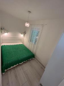 Postel nebo postele na pokoji v ubytování Helló Zsóry Apartman