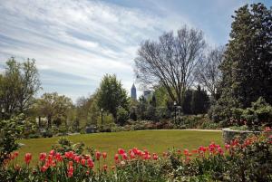 a park with flowers and a building in the background at Kimpton Sylvan Atlanta - Buckhead by IHG in Atlanta