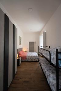 a bedroom with two bunk beds and a bedskirts at Dimora Francesca in Salerno