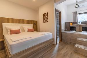 Postel nebo postele na pokoji v ubytování Verdi Rooms
