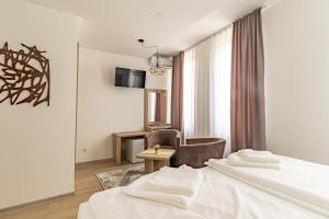 Postel nebo postele na pokoji v ubytování Verdi Rooms
