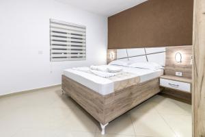 Krevet ili kreveti u jedinici u okviru objekta Apart-Hotel Prestige +24 fotografije