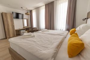 Postel nebo postele na pokoji v ubytování Verdi Rooms