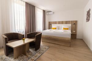 Postel nebo postele na pokoji v ubytování Verdi Rooms