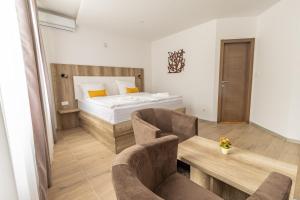 Postel nebo postele na pokoji v ubytování Verdi Rooms