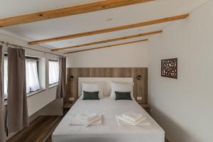 Postel nebo postele na pokoji v ubytování Verdi Rooms