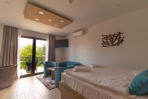 Postel nebo postele na pokoji v ubytování Verdi Rooms