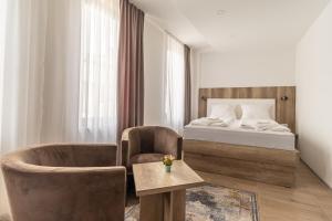 Postel nebo postele na pokoji v ubytování Verdi Rooms