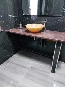 a bathroom with a bowl sink on a counter at L'APPARTAMENTO DEL MARE in Marsala +60 photos