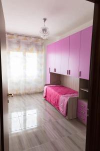 Posteľ alebo postele v izbe v ubytovaní L'APPARTAMENTO DEL MARE + 37 fotografií