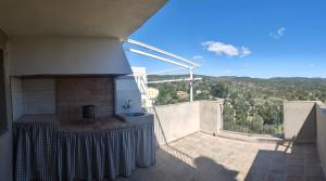 a view from the balcony of a house with a fireplace at Casa Monferrer in Useras