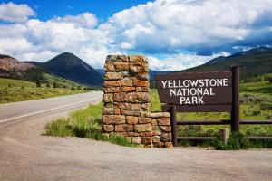 a sign for the yellowstone national park on the side of a road at Kimpton - Armory Hotel Bozeman by IHG in Bozeman