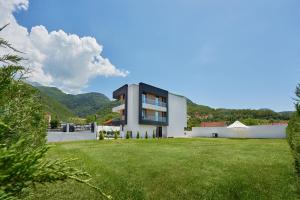 a modern house with a large yard at Georgiy Lux Apartments in Lastva