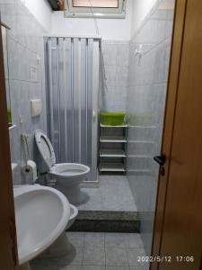 a bathroom with a toilet and a sink and a shower at Villa Scialara in Vieste +94 photos