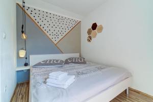 Łóżko lub łóżka w pokoju w obiekcie Apartment Ćosić Green
