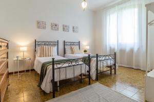 Giường trong phòng chung tại Villa Donatelli