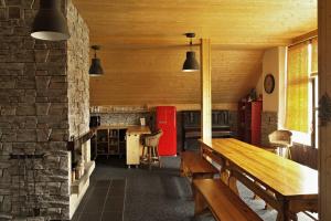 a room with a wooden bench and a stone wall at Chata Ryba in Pernink +23 photos