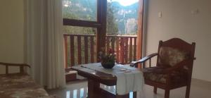a room with a table and a chair and a window at Gocta Miradors in Cocachimba