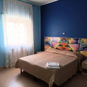 Cama o camas de una habitación en Il Fiore di San Giovanni B&B