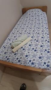 a bed with blue and white stars on it at Goka apartments in Gevgelija
