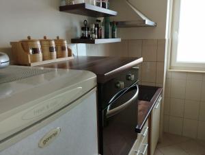 Kuchyňa alebo kuchynka v ubytovaní Deep blue apartment