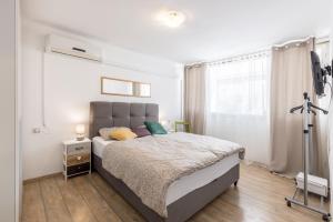 Posteľ alebo postele v izbe v ubytovaní Sunny City Apartment