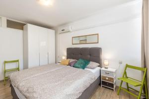 Posteľ alebo postele v izbe v ubytovaní Sunny City Apartment
