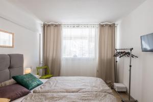 Posteľ alebo postele v izbe v ubytovaní Sunny City Apartment