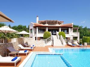 a villa with a swimming pool and a house at Villa Metapothia Gavalochori Crete in Gavalochori