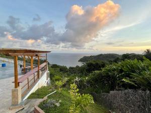 a view of the ocean from a house at The Victory Villa in Parrot Hall