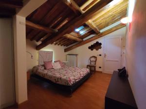 Ένα ή περισσότερα κρεβάτια σε δωμάτιο στο La terrazza di Elas a Uzzano