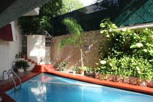 Bazén v ubytování Hotel Plaza Kokai Cancún nebo v jeho okolí