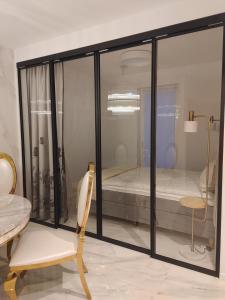 a room with a window with a bed in it at Apartament Lipowa 2 in Mrągowo +18 photos