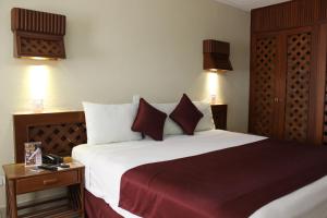 Postel nebo postele na pokoji v ubytování Hotel Plaza Kokai Cancún