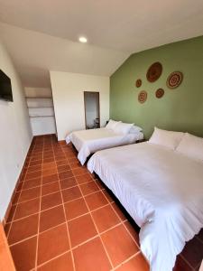 A bed or beds in a room at MOCANA BIOHOTEL