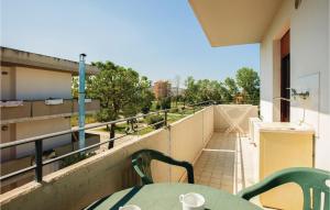 a balcony with a table and chairs on a building at Bilo Sup in Alba Adriatica